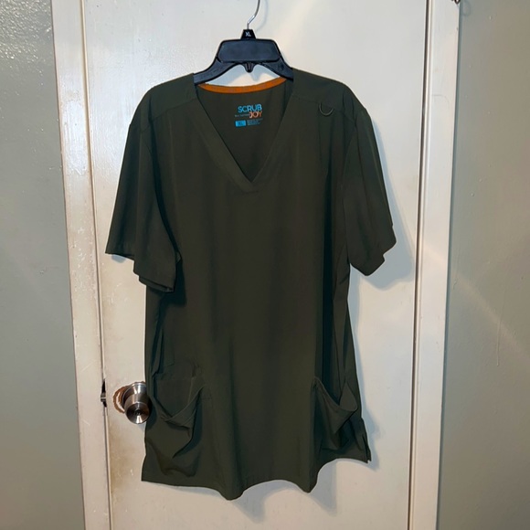 These set of scrubs are by scrub Joy the material is very soft and flexible. - Picture 2 of 2